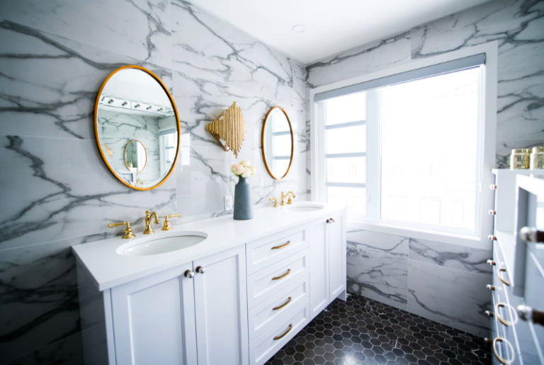 a bathroom with a mirror and a sink